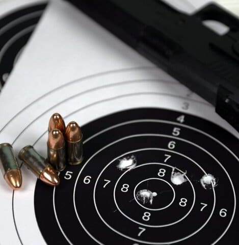 Pistol, ammunition and shooting target at the Colorado Boots range