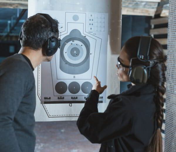 Instructor reviewing a target with a student